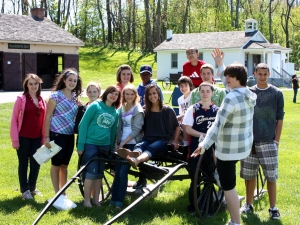 Group of kids around Amish wagon Group of kids around Amish wagon