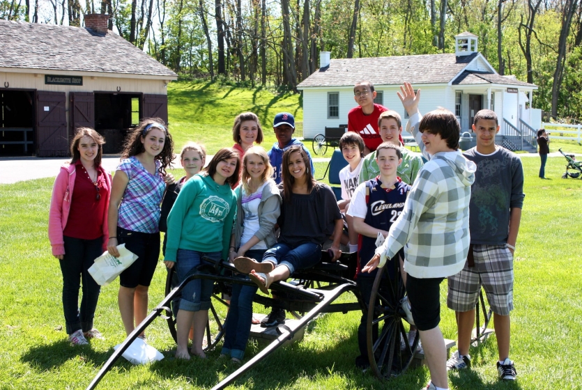 Group of kids around Amish wagon Group of kids around Amish wagon