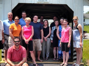 Group standing in front of bridge Group standing in front of bridge