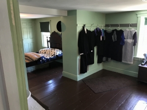 Amish suits and dresses hanging in an Amish bedroom Amish suits and dresses hanging in an Amish bedroom