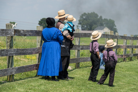 Amish people in Pennsylvania Lancaster, Usa - June 25, 2016: Amish people in Pennsylvania. Amish are known for simple living with touch of nature contacy, plain dress, and reluctance to adopt conveniences of modern technology