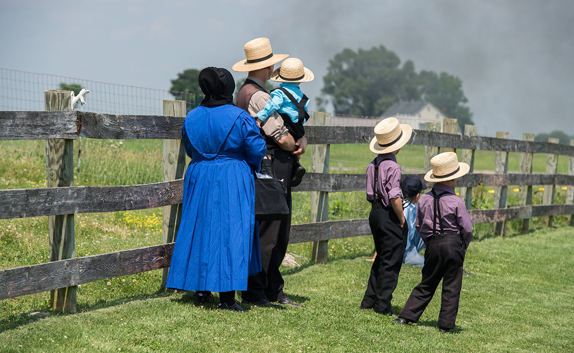 Amish people in Pennsylvania Lancaster, Usa - June 25, 2016: Amish people in Pennsylvania. Amish are known for simple living with touch of nature contacy, plain dress, and reluctance to adopt conveniences of modern technology
