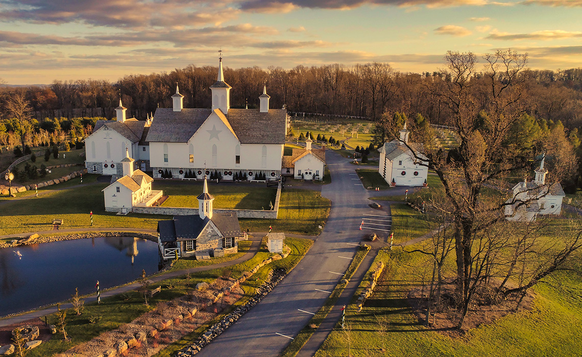 Aerial View at Sunset of Antique Restored Barns An Aerial View at Sunset of Antique Restored Barns